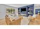 Stylish living room showcasing a sleek fireplace, custom built-ins, and ample natural light from a large window at 107 Hilltop Dr, Longwood, FL 32750