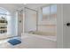 Primary bath is beautifully lit and features tub with shower at 1240 Falconcrest Blvd, Apopka, FL 32712