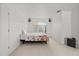 Minimalist bedroom with natural light from window and a comfortable bed at 1240 Falconcrest Blvd, Apopka, FL 32712