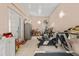 Spacious bonus room features gym equipment and adjacent french doors at 1240 Falconcrest Blvd, Apopka, FL 32712