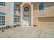 An eye-level front exterior shot of the home showing the front entrance and garage at 1240 Falconcrest Blvd, Apopka, FL 32712