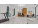Comfortable living room with a fireplace, built-in shelving, and large windows, offering ample natural light at 1240 Falconcrest Blvd, Apopka, FL 32712
