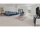 Spacious bedroom with large windows, a sitting area, and light-colored carpeting at 1240 Falconcrest Blvd, Apopka, FL 32712