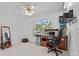Office space with a large window, desk, computer, and comfortable chair at 1240 Falconcrest Blvd, Apopka, FL 32712