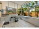 Outdoor patio with utility sink and screened windows at 1240 Falconcrest Blvd, Apopka, FL 32712