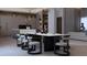 Elegant dining room with modern lighting, spacious table, and stylish seating at 12818 Brunello Cir, Clermont, FL 34711