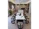 Elegant dining room featuring a marble table and modern chandelier at 12818 Brunello Cir, Clermont, FL 34711