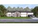 Charming one-story home with lush landscaping, manicured lawn, and an attached two-car garage at 12818 Brunello Cir, Clermont, FL 34711