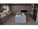 Contemporary kitchen with large island, modern cabinetry, and ample counter space at 12818 Brunello Cir, Clermont, FL 34711