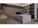 Elegant kitchen with large island, modern appliances, and ample cabinet space at 12818 Brunello Cir, Clermont, FL 34711