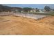 Suburban new construction shows foundation of a home ready for framing, in a sunny neighborhood with green lawns at 12818 Brunello Cir, Clermont, FL 34711