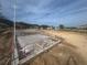 Suburban new construction shows foundation of a home ready for framing, in a sunny neighborhood near the water at 12818 Brunello Cir, Clermont, FL 34711