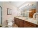 Bathroom features a vanity with wood cabinets, and a glass-enclosed shower at 134 Heron Bay Cir, Lake Mary, FL 32746