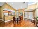 Dining area with hardwood floors, adjacent to the kitchen, perfect for Gathering meals and gatherings at 134 Heron Bay Cir, Lake Mary, FL 32746