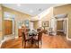 Dining area showing hardwood floors and natural light with direct sightlines to other living spaces at 134 Heron Bay Cir, Lake Mary, FL 32746