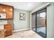Kitchen view with sliding glass door leading to outdoor patio and tile floors at 134 Heron Bay Cir, Lake Mary, FL 32746