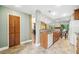 Bright eat-in kitchen with granite countertops, wood cabinets, tile floors, and stainless steel appliances at 134 Heron Bay Cir, Lake Mary, FL 32746
