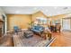 Inviting living room with hardwood floors, open to dining area and kitchen, perfect for entertaining at 134 Heron Bay Cir, Lake Mary, FL 32746