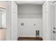 Walk-in closet featuring shelving, laundry hookups, and ample storage space at 13881 Sw 80Th Ave, Ocala, FL 34473