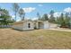Charming single-story home showcasing the side elevation, and large lawn at 13881 Sw 80Th Ave, Ocala, FL 34473
