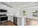 Bright kitchen featuring stainless appliances, and white cabinets at 13881 Sw 80Th Ave, Ocala, FL 34473