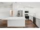 Modern kitchen with white cabinetry, stainless appliances, and quartz counters at 13881 Sw 80Th Ave, Ocala, FL 34473