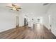 Open-concept living space with vaulted ceilings, and wood-look flooring at 13881 Sw 80Th Ave, Ocala, FL 34473