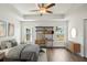 Airy bedroom showcasing modern furnishings, tray ceiling, and plenty of natural light at 13881 Sw 80Th Ave, Ocala, FL 34473