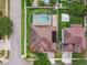 A bird's eye view shows a backyard pool, landscaping, and a basketball court, perfect for outdoor recreation at 14003 Sobrado Dr, Orlando, FL 32837