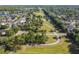 Aerial shot overlooking a community park that features a walking trail, open field, and mature landscaping at 14003 Sobrado Dr, Orlando, FL 32837