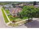 An aerial view shows the home's curb appeal and landscaping at 14003 Sobrado Dr, Orlando, FL 32837