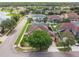 An aerial view shows the home's placement in a neighborhood with green lawns at 14003 Sobrado Dr, Orlando, FL 32837