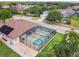 Beautiful home features a screened-in pool and lush landscaping in a well-maintained backyard setting at 14003 Sobrado Dr, Orlando, FL 32837