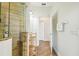Modern bathroom featuring walk-in shower, wood floors and vanity sink at 14003 Sobrado Dr, Orlando, FL 32837