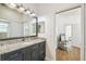 Bathroom features a granite vanity, wood floors and an ensuite bathroom at 14003 Sobrado Dr, Orlando, FL 32837