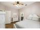 Bedroom features hardwood floors, ceiling fan and a ensuite bathroom at 14003 Sobrado Dr, Orlando, FL 32837