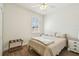 Bright bedroom features wood floors, a ceiling fan and a large window at 14003 Sobrado Dr, Orlando, FL 32837