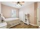 Bedroom features hardwood floors, ceiling fan and a closet at 14003 Sobrado Dr, Orlando, FL 32837
