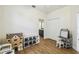 Bright playroom featuring hardwood floors, closet, and an ensuite bathroom at 14003 Sobrado Dr, Orlando, FL 32837
