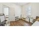 Bright playroom features wood floors and natural light from the shuttered window at 14003 Sobrado Dr, Orlando, FL 32837
