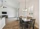 The dining area has a modern table set under a chandelier, blending style with comfort at 14003 Sobrado Dr, Orlando, FL 32837