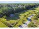 Overhead view of the community dog park with a gazebo, fenced areas, and a paved walkway at 14003 Sobrado Dr, Orlando, FL 32837