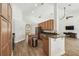 Well-lit kitchen features granite counters, stainless appliances, and wood cabinetry for a modern look at 14003 Sobrado Dr, Orlando, FL 32837