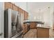Bright kitchen featuring stainless appliances, granite countertops, and wood-look flooring at 14003 Sobrado Dr, Orlando, FL 32837