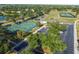Aerial view of the park with basketball courts, playground, and ample parking for the community at 14003 Sobrado Dr, Orlando, FL 32837