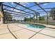 An inviting screened pool area with an expansive patio is perfect for entertaining at 14003 Sobrado Dr, Orlando, FL 32837