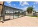 An inviting screened pool area and brick patio offers outdoor enjoyment at 14003 Sobrado Dr, Orlando, FL 32837