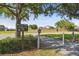 Shingle Creek walking trail in a quiet community with sidewalks and lush green landscape at 14003 Sobrado Dr, Orlando, FL 32837