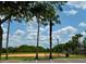 Exterior shot of a well maintained baseball field on a partly cloudy day at 14479 Tanja King Blvd, Orlando, FL 32828