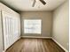 Cozy bedroom featuring a ceiling fan, natural light, and a closet for ample storage at 14479 Tanja King Blvd, Orlando, FL 32828
